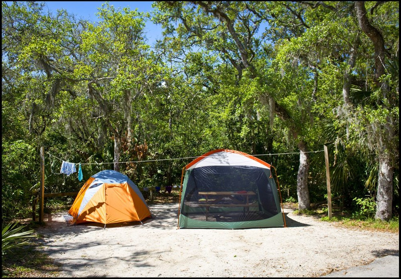 Anastasia State Park
300 Anastasia Park Road, St. Augustine
With four miles of pristine beach and 139 available campsites, Anastasia State Park is ready and waiting to be explored. Each campsite comes equipped with electricity and water, a picnic table, an in-ground grill and a fire pit, so you don’t have to worry about resorting to primitive survival techniques. On Saturdays, there’s even a farmers market on the property, so you can enjoy your fresh fruits and veggies with a little extra sand and sunshine.