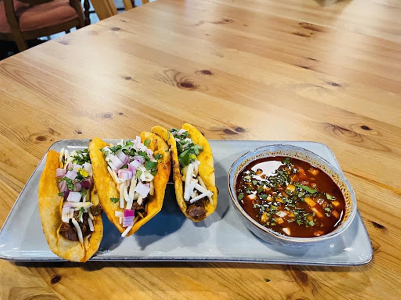 Persimmon Hollow Lake Eola
227 N Eola Dr
Birria Tacos 
3 soft tortillas, jackfruit, onions, cilantro, and vegan mozzarella cheese, served with birria sauce and a side of homemade hot sauce.
Some restaurants offering larger selection, side and drinks. Click here to see the menus.