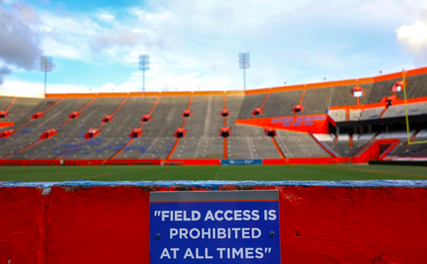 A no trespassing sign is posted along a wall surrounding Steve Spurrier-Florida Field at Ben Hill Griffin Stadium in Gainesville, Fla., Oct. 1, 2023.