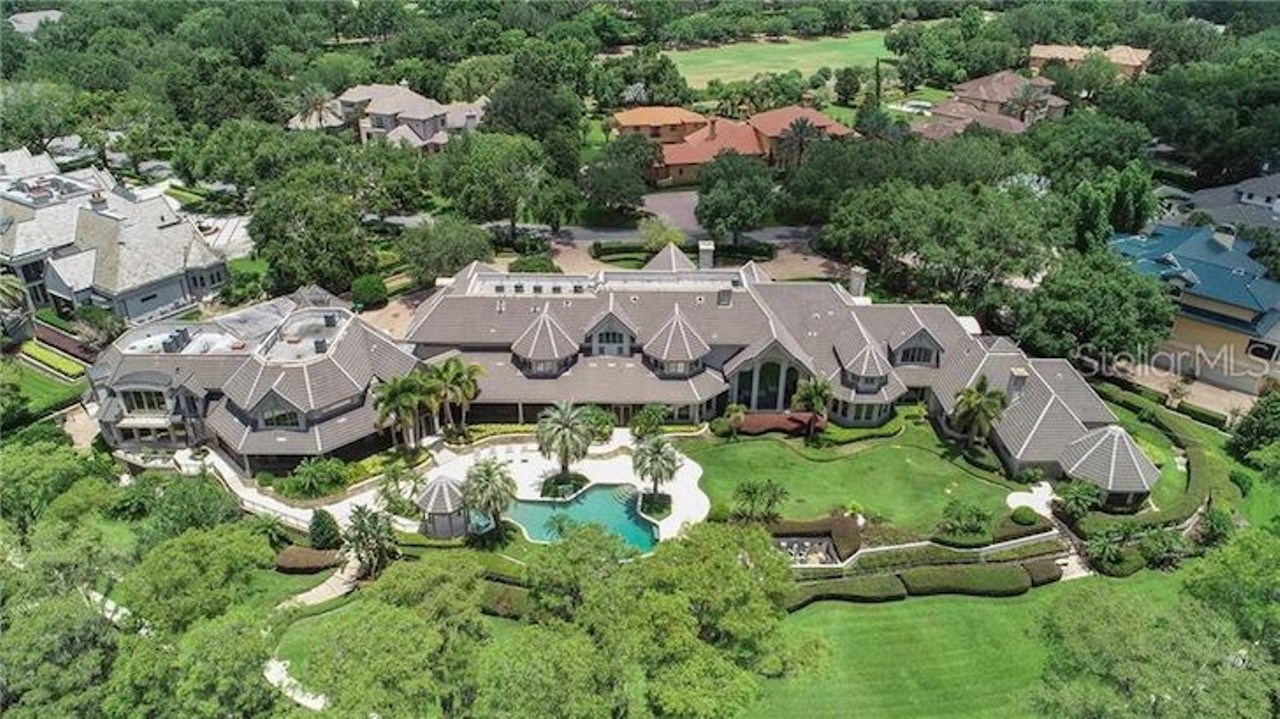 9912 Lake Louise Dr, Windermere
$23,000,000
This is the biggie, the most expensive home for sale in the Orlando area. It&#146;s an enormous, majestic waterfront mansion inside the exclusive golf community of Isleworth Country Club. Let&#146;s start with the garage, which is large enough to hold more than 40 cars, giving you a sense of the type of family who can afford to live here. Nearly 800 feet of water frontage offers &#147;commanding views&#148; from the grand entrance, kitchen and even from the guest quarters. It features marble flooring throughout, with a majestic double staircase with floor to ceiling windows overlooking 3 acres of land and unobstructed views of the Butler Chain of Lakes. Perfectly manicured gardens lead to a double boat lift and double jet ski dock. This is the ultimate Orlando dream home.
