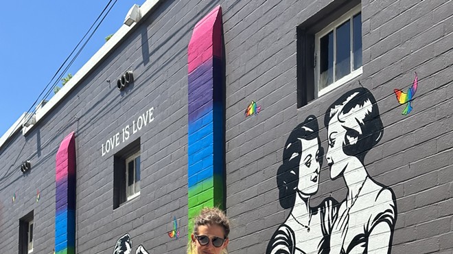 LA street artist Corie Mattie finishes a new "Love Is Love" mural in Orlando's Thornton Park neighborhood (August 2023)