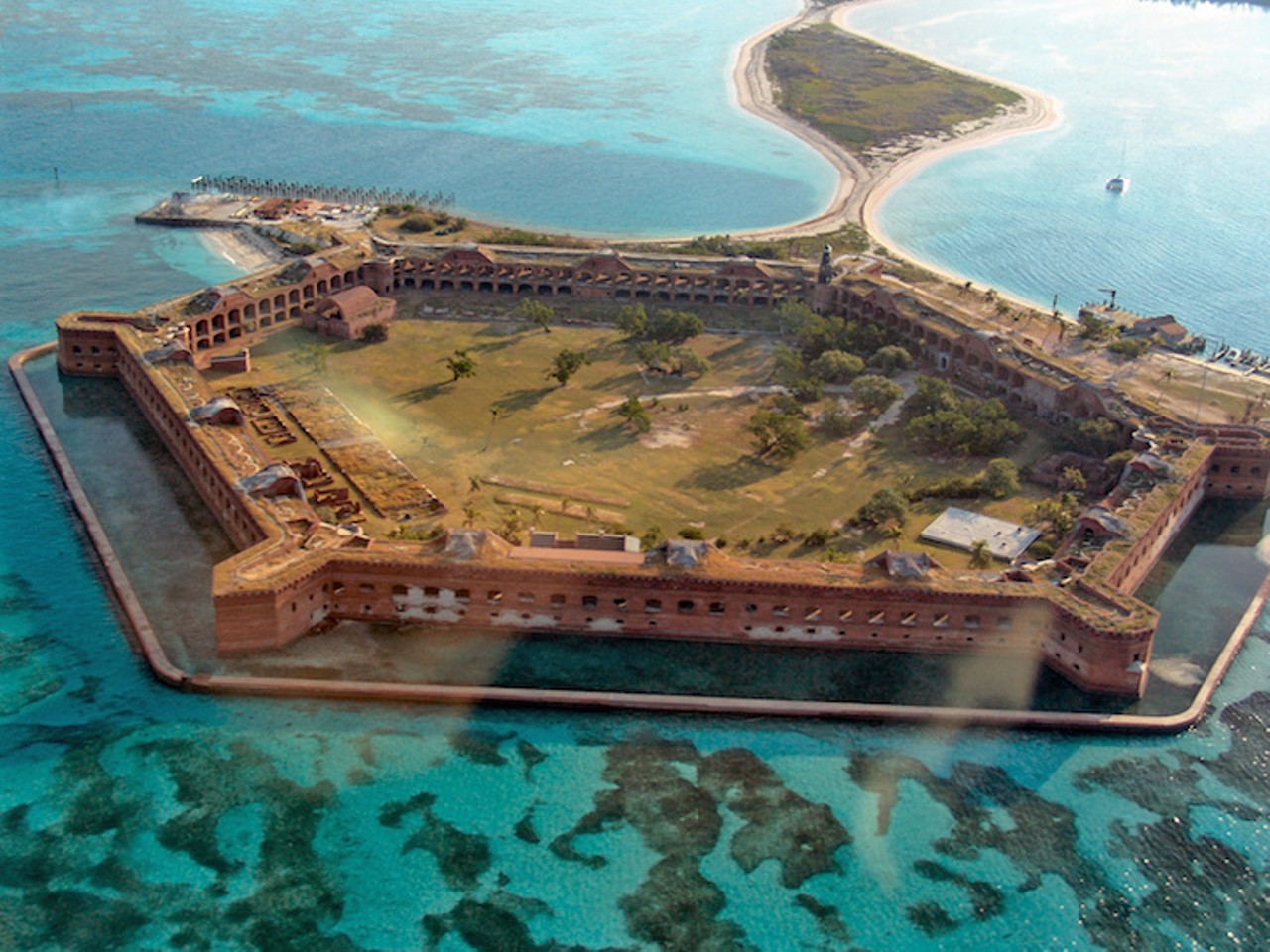 Dry Tortugas
Accessible only by boat or seaplane, this secluded island is packed with national history. Take a walk through the ramparts of the 14th century Fort Jefferson. The best way to explore this paradise is by snorkeling and diving. 
Photo via Adobe Stock