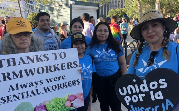 Organizers with the Farmworkers Association of Florida at the 'March for Our Dreams & Freedom' in downtown Orlando (May 1, 2023)
