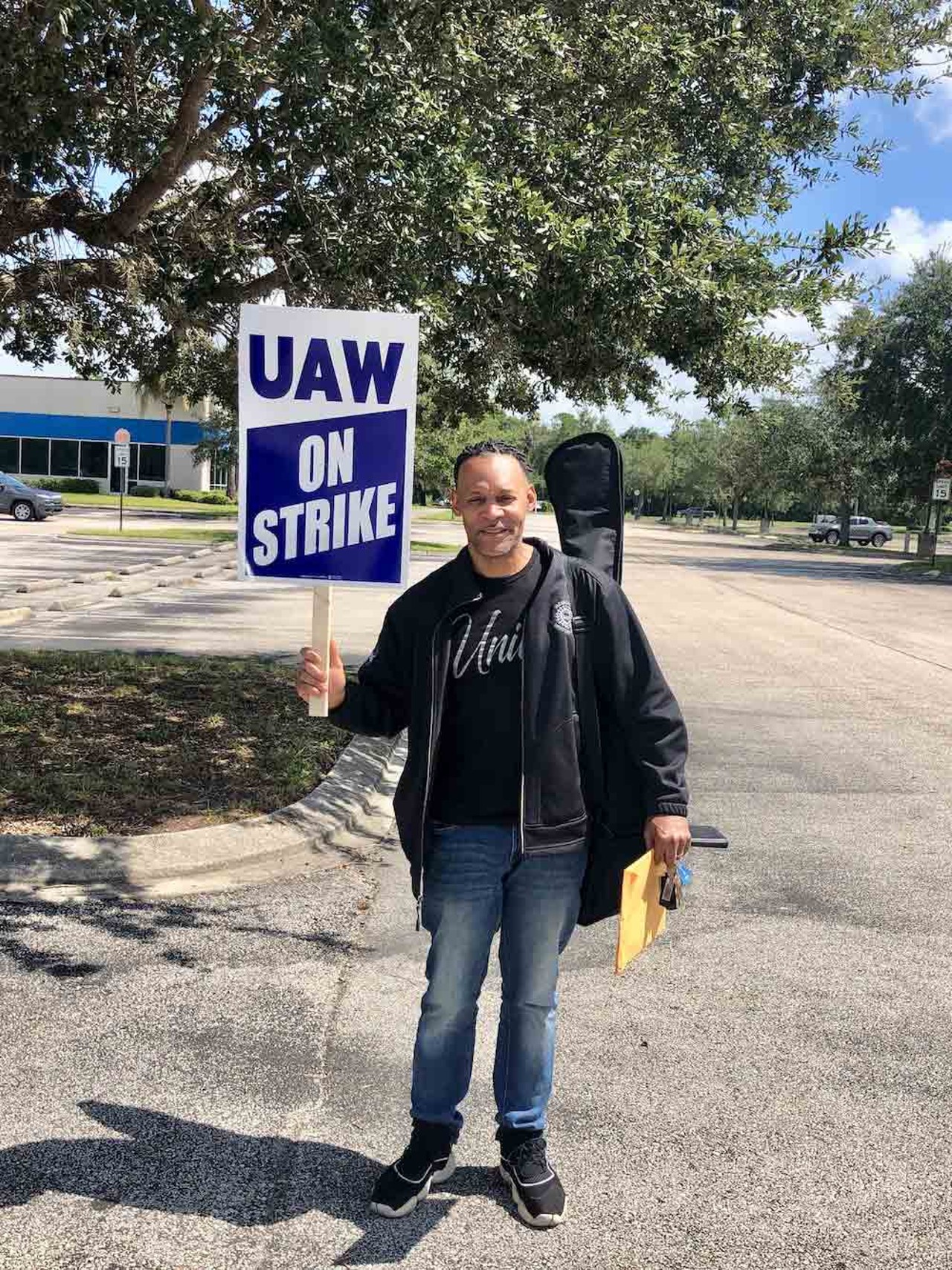 Keith Phelps, a 29-year autoworker, readies for a strike outside of a Chrysler/Stellantis parts depot in Orlando on Sept. 22, 2023.