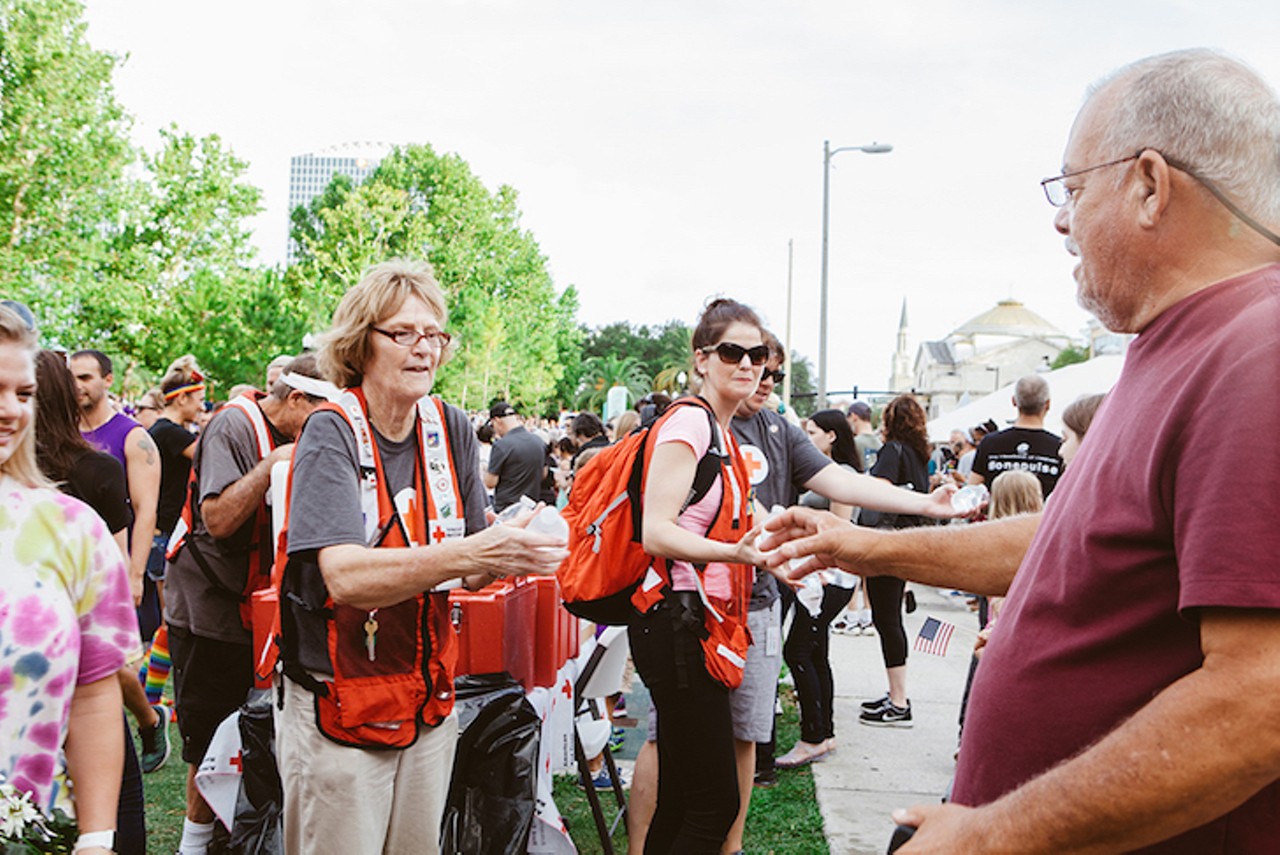 Volunteers from the American Red Cross help vigil attendees stay hydrated at Lake Eola.
Photo by Hannah Glogower