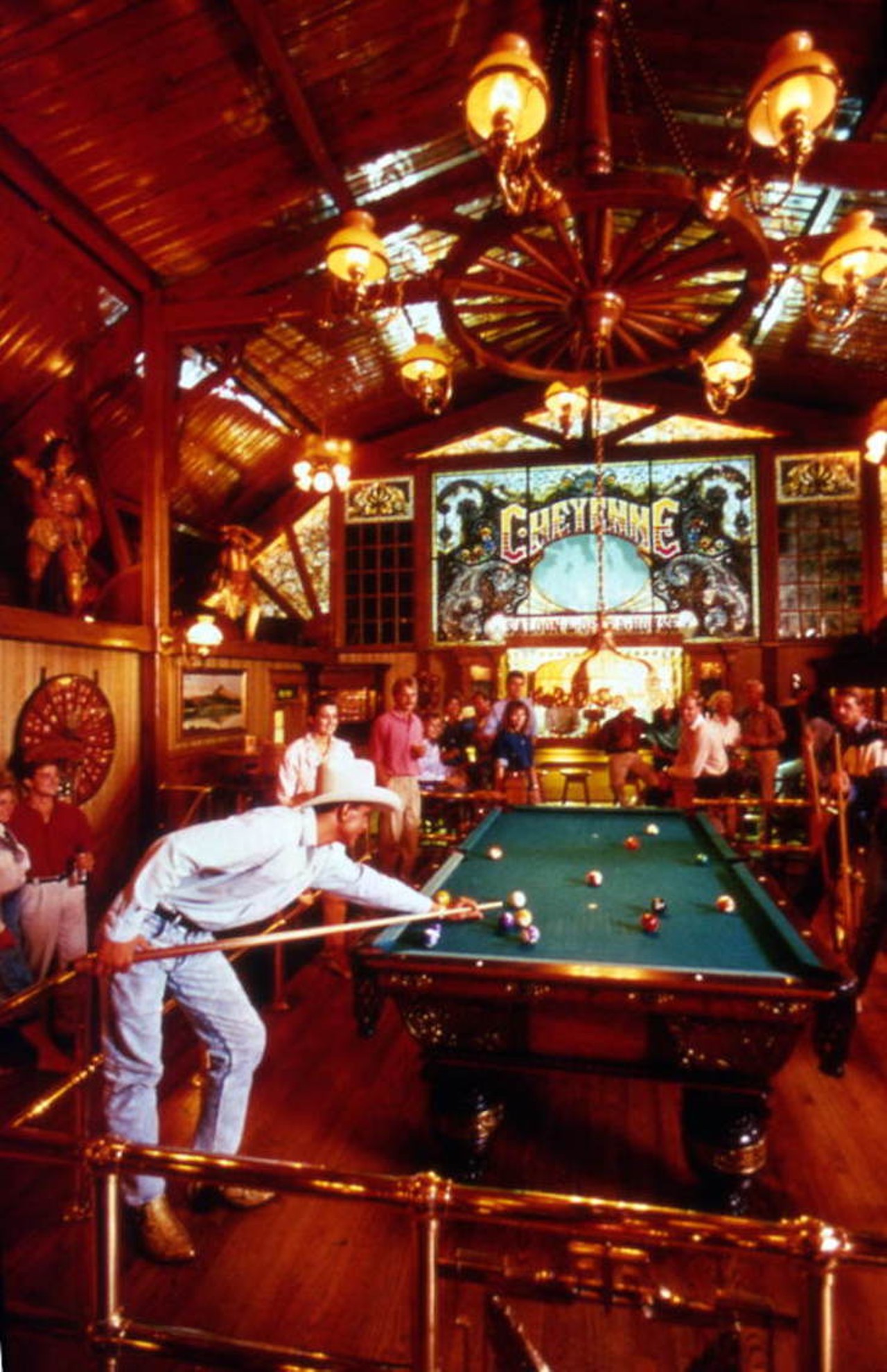 Tourists shooting pool at the Cheyenne Saloon and Opera House in Church Street Station, likely after 1972.