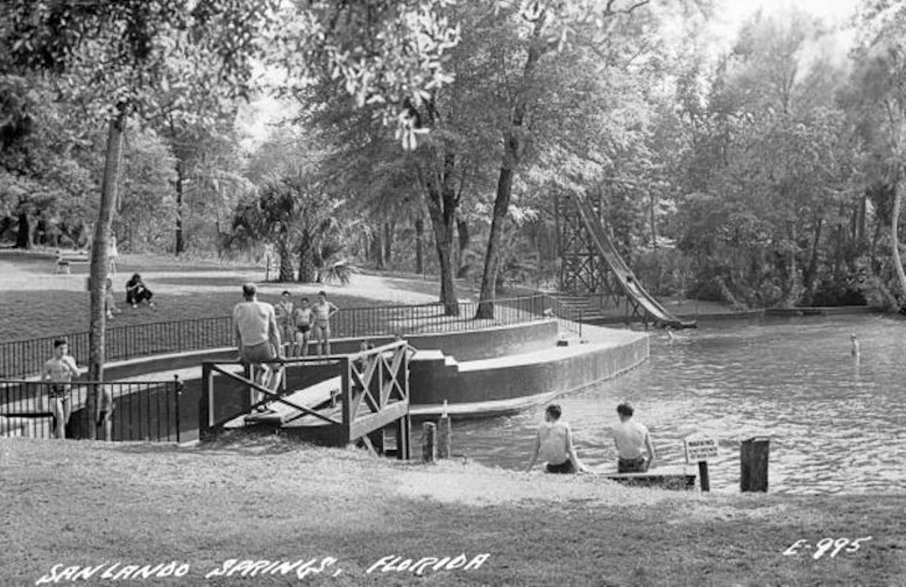 People using the diving board and slide at Sanlando Springs, 1950.