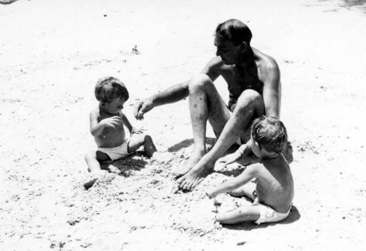 Grandfather and twins play on the beach at the springs - Sanlando Springs, 1946.