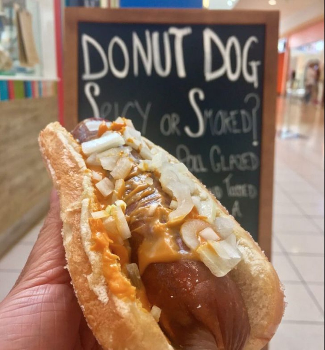 Sausage Shack: Donut Dog  
400 W. New England Ave., Winter Park, 407-576-9552
Sweet and savory collide at the Sausage Shack with their donut dog: smoked Polish kielbasa set in a hot dog bun that&#146;s glazed with butter and tossed in sugar. This delicacy is topped with sweet relish and sweet hot mustard, then drizzled with cheese sauce.
Photo via Yelp/Abby E.