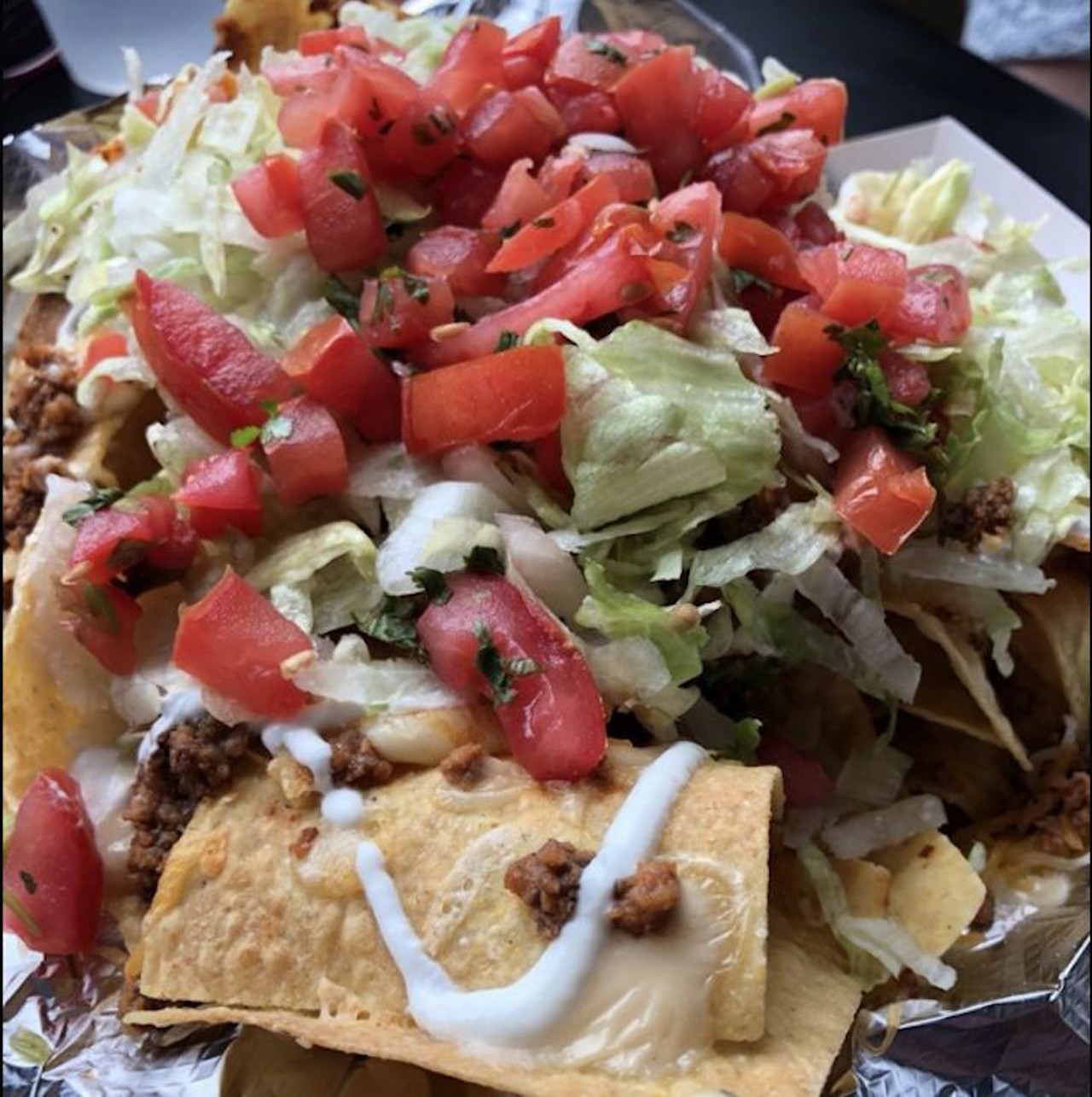Gringos Locos: O.G. Nachos  
Multiple locations
Who said you can&#146;t eat just chips for dinner? The O.G. nachos at Gringos are a whole meal. They&#146;re nachos layered with cheese, queso, sour cream, lettuce and pico. If you want, add a little meat to those nachos, too.
Photo via Yelp/April B.