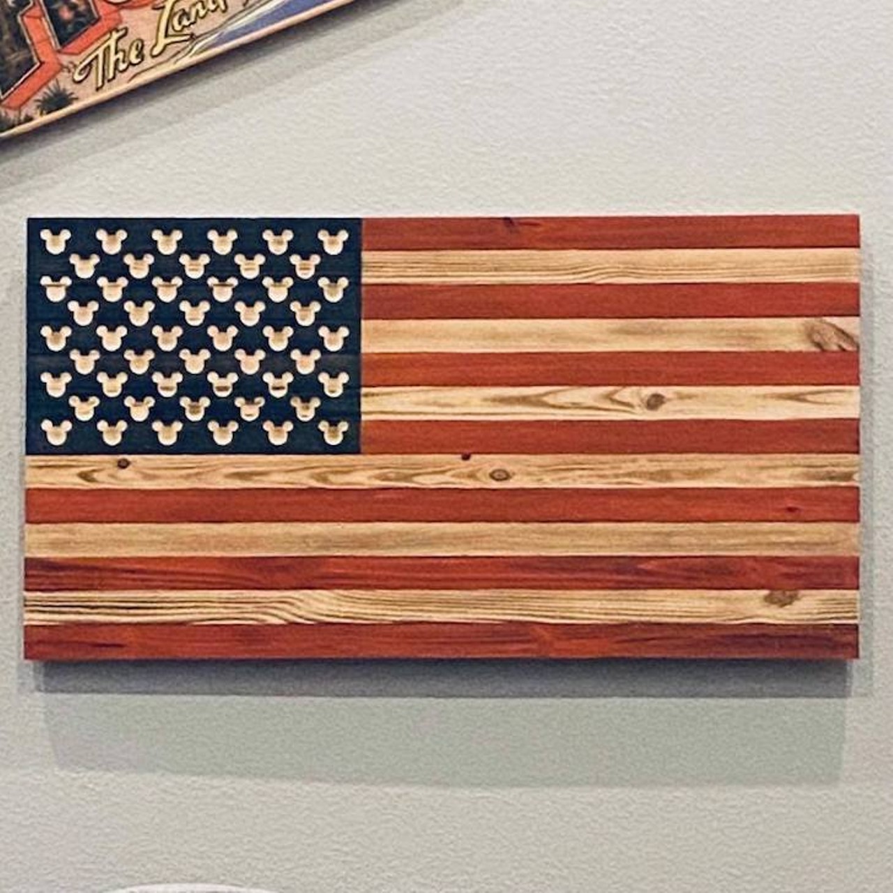 It Started With A Flag   Mark Newman was a cast member for 23 years before being laid off in September. Now, he makes beautiful, handcrafted wooden American flags in his shop.