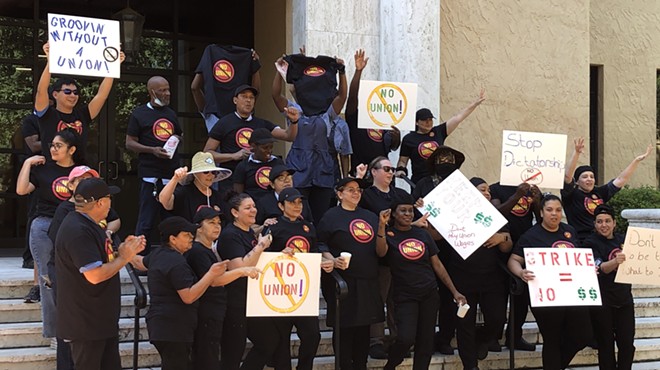 Sodexo employees gather for a "No Union" rally at Rollins College in Winter Park