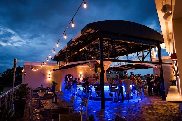 M Lounge 
    
    2000 N. Orange Ave.
     M Lounge is a rooftop bar with a view of downtown Orlando, offers two different happy hour specials. The first one is downstairs from 4 p.m. to 7 p.m. and the second one starts upstairs at 6 p.m. and ends at 8 p.m. M Lounge has a multitude of different cocktails for $7, such as their Old-Fashioned and Fog Cutter, as well as $4 beers and $5 glasses of wine.
    
    Photo via M Lounge/Facebook