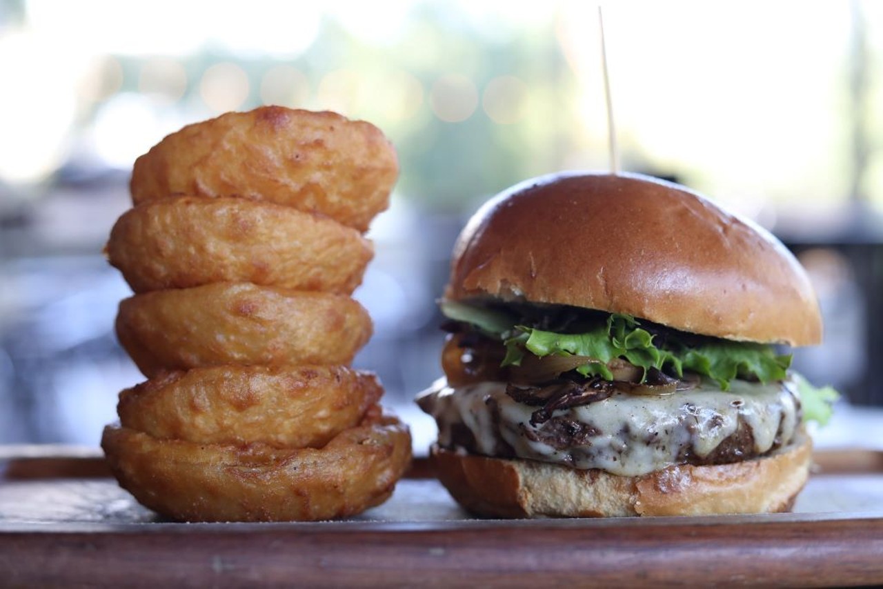 Teak Neighborhood Grill 
Multiple Locations
Take your pick out of 37 signature handcrafted burgers. Make sure to pair with their crispy, beer-battered onion rings. 
Photo via Teak Neighborhood Grill/Facebook