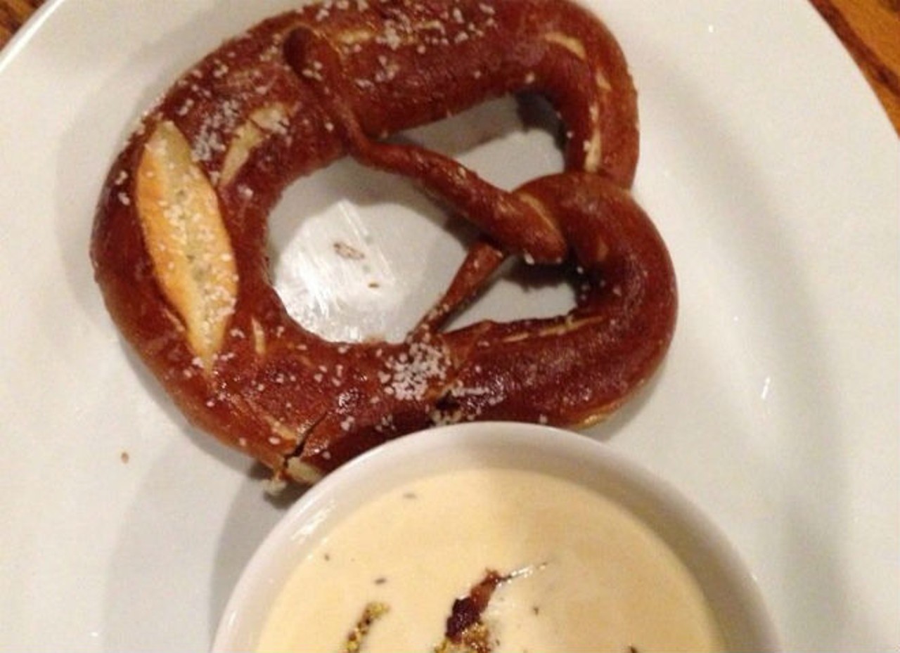Bavarian Soft Pretzel with Pilsner Fondue
Schumann's J&auml;ger Haus, 25 W. Church St., 407-985-1950; schumannsjagerhaus.com
Schumann's hand-twisted pretzel is big (but not comedically so) and poofy, strewn with salt crystals and served with a generous portion of beer-infused cheese sauce dabbed with whole-grain mustard.
Pic via Yelp