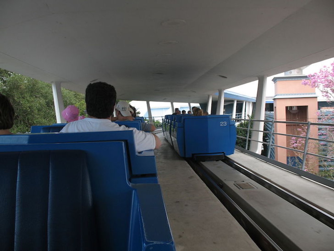 High-five guests on passing PeopleMover 
Unlike newer rides with the envelope of safety, the PeopleMover comes from a simpler time where sticking your hand out of a moving ride could mean losing it. There are a few times, like just before entering Space Mountain, where the cars pass each other just close enough that sticking your hand out could get you a high-five from other guests. The simple joy of a high-five during the middle of a slow ride is surprisingly satisfying. 
Photo via Wikipedia