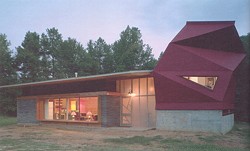 The Lucy House, designed and built by Samuel Mockbee's Rural Studio in 2002, reuses 7,000 cast-off carpet tiles.