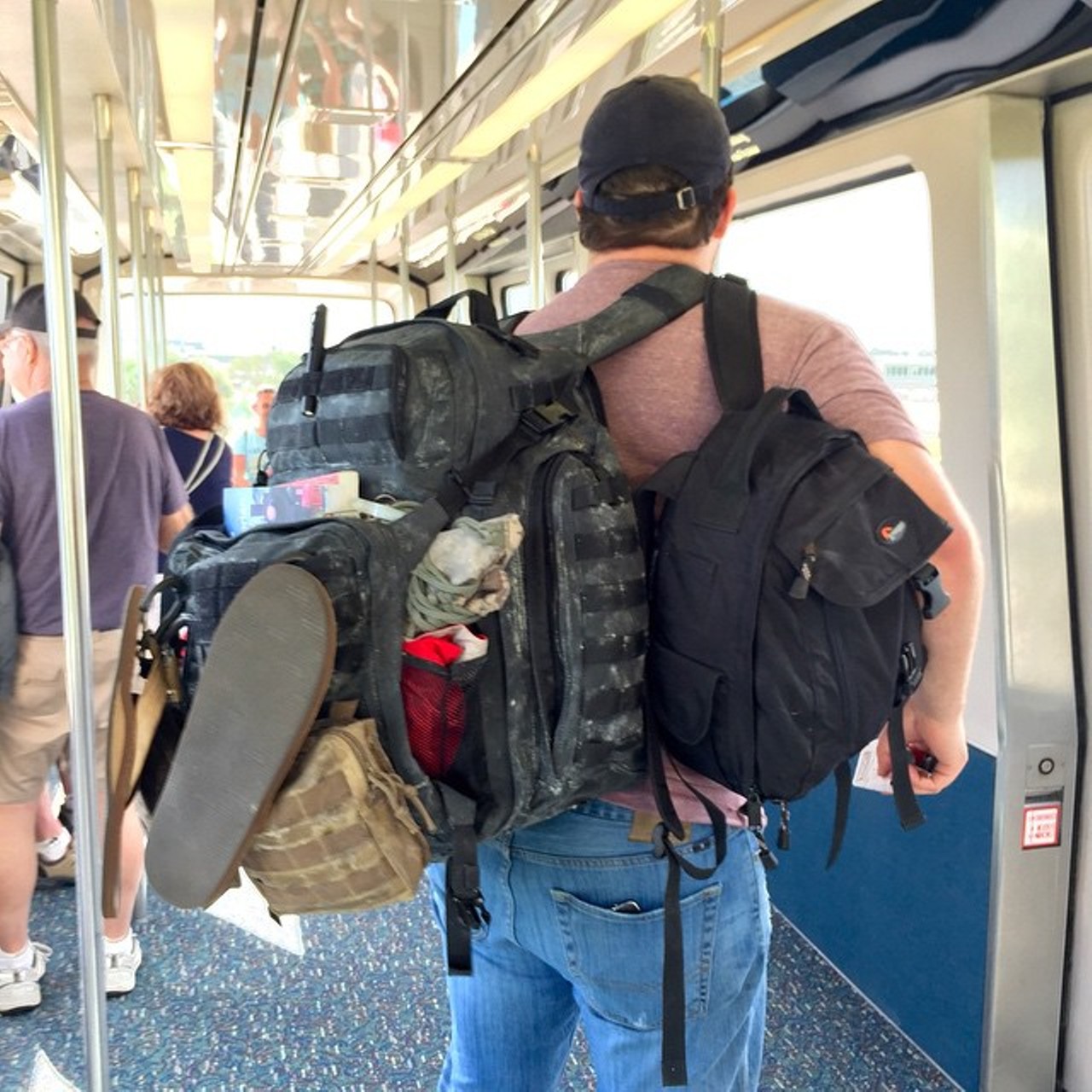 Look, a guy abusing the carry-on policy. You get 40 points. 
Photo via peepsabroad