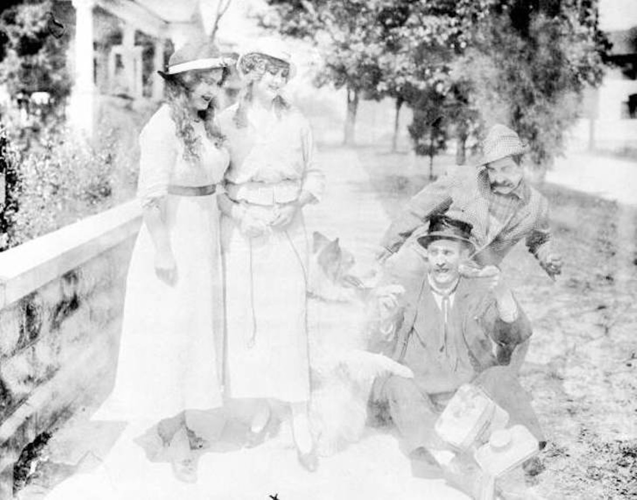 A motion picture scene from 1916, L-R: Pearl Shepard(?), Ethel Burton Palmer, Bobby Burns and Walter Stull. An accompanying note says, "This image was collected by filmmaker William "Billy" Bletcher (1894-1979) while working for the Vim Comedy Company between 1915 and 1917. The small film studio was based in Jacksonville and New York. The company produced hundreds of two-reel comedies (over 156 comedies in 1916 alone). Before going out of business in 1917, it employed such stars as Oliver Hardy, Ethel Burton, Walter Stull, Arvid Gillstrom, and Kate Price."