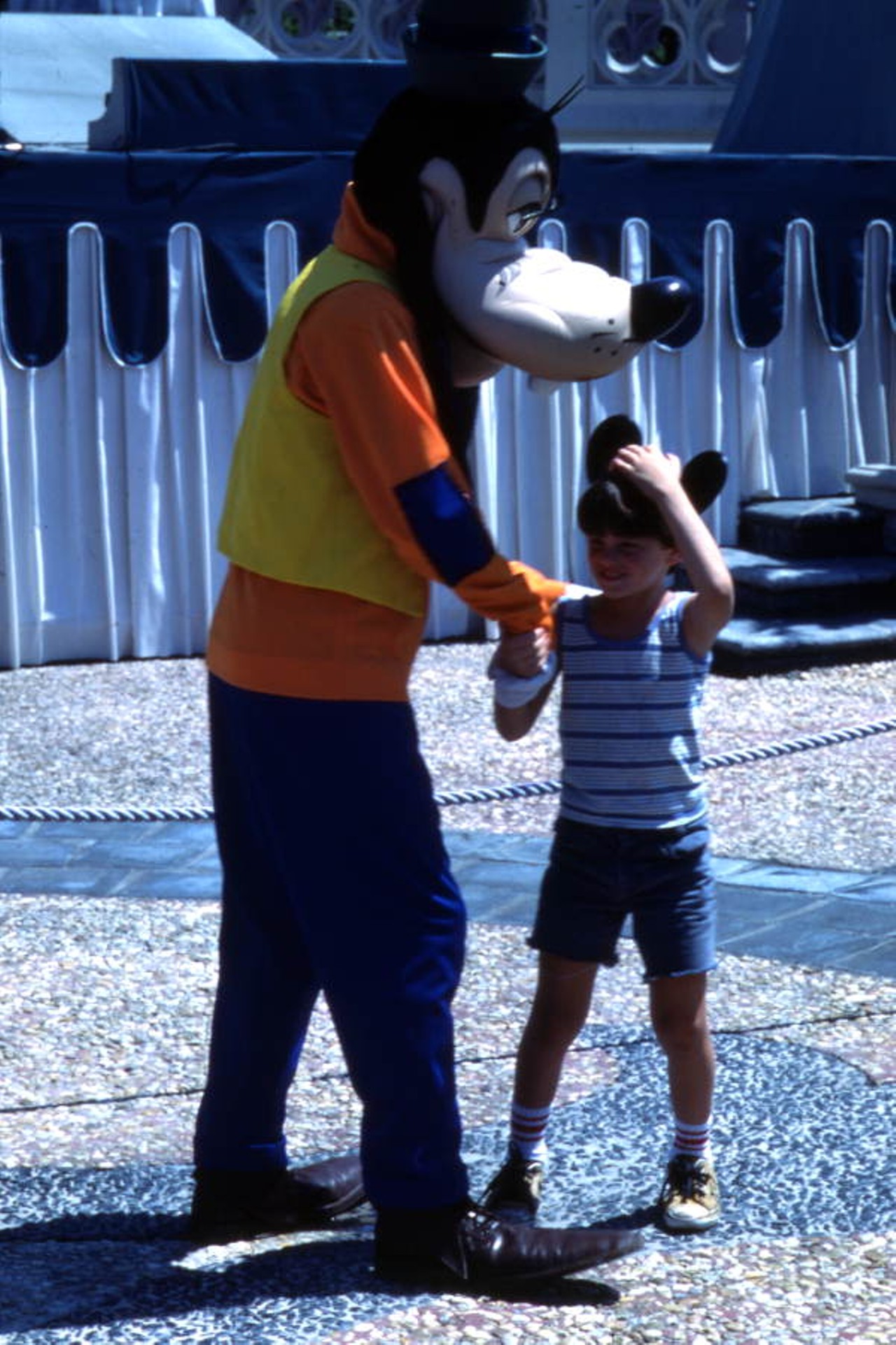 Child meeting Goofy at the Magic Kingdom amusement park in Orlando, Florida, 1977