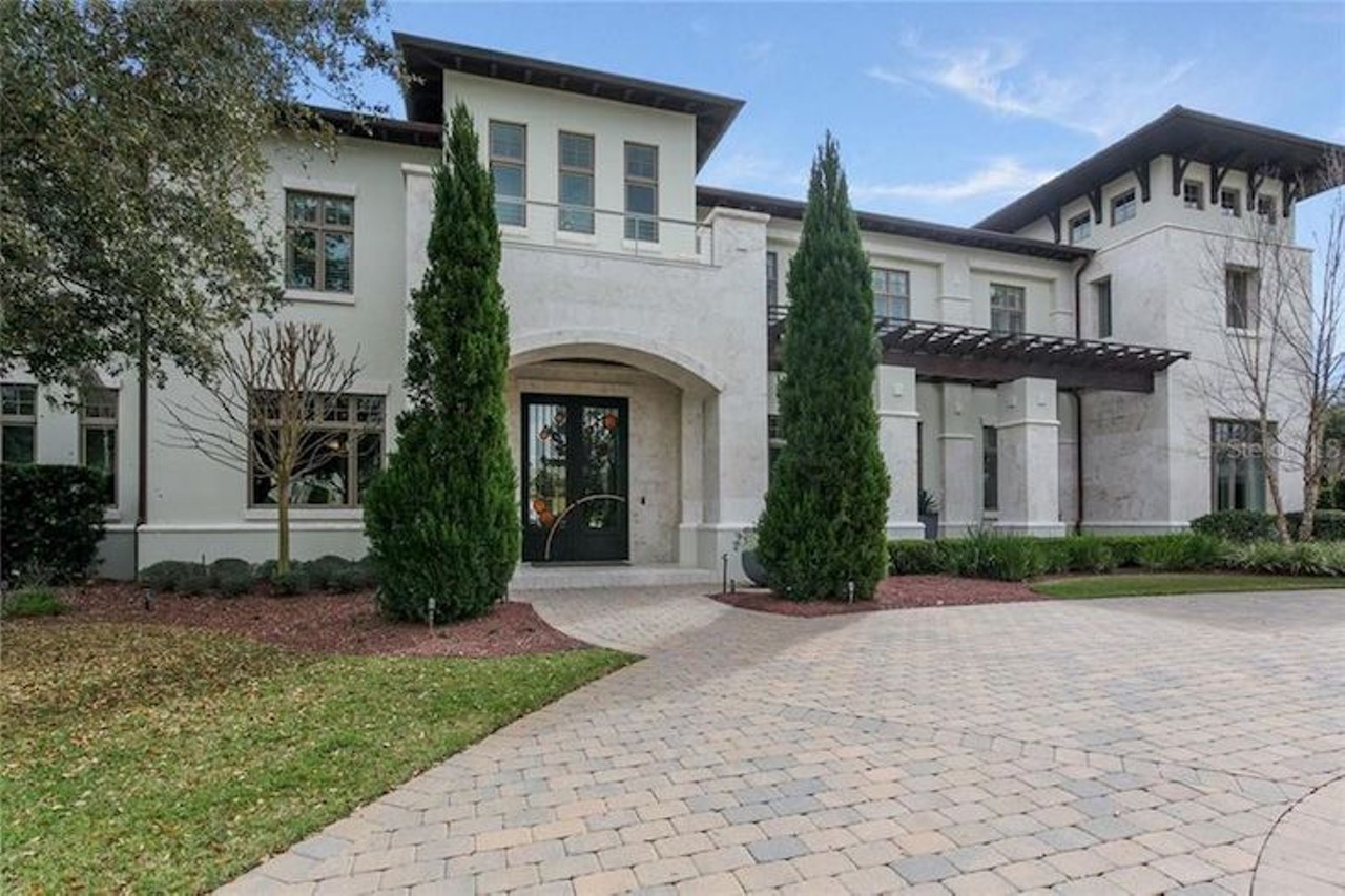 This $6.6 million Orlando home on an 18-hole golf course features a two-story wine room