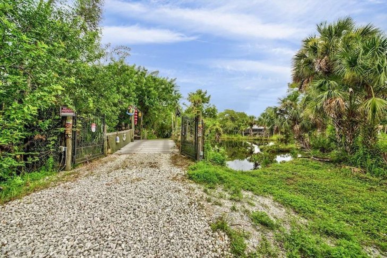 This Florida bungalow for sale comes with its own private island, for less than $400K