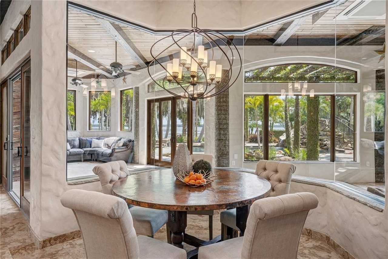 This lakefront Mediterranean mansion in suburban Orlando once housed a zebra farm