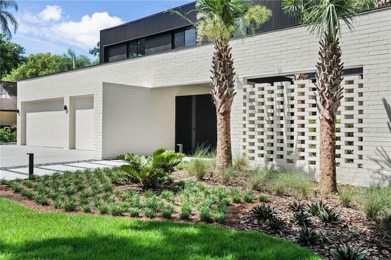 This ultra-modern Orlando home blends seamlessly into its lakeside surroundings