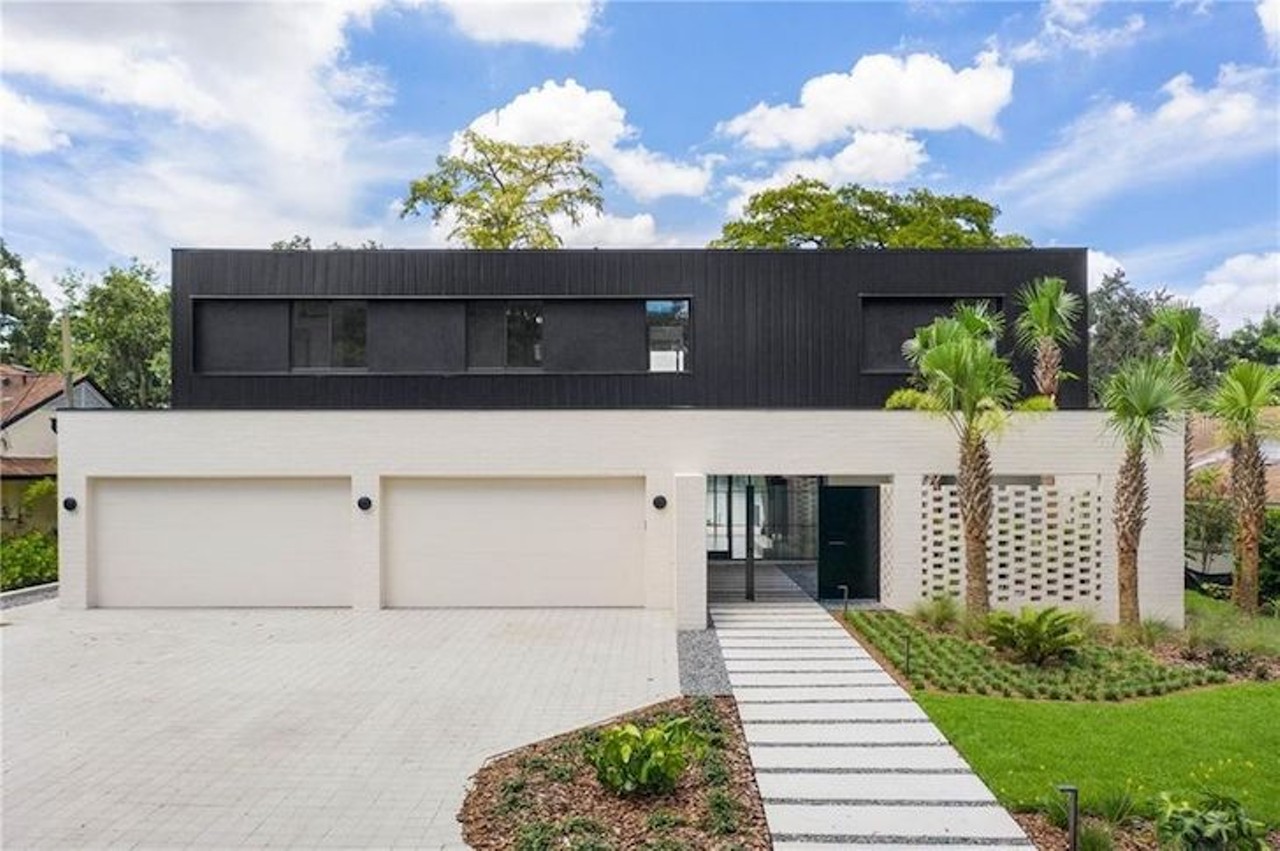 This ultra-modern Orlando home blends seamlessly into its lakeside surroundings