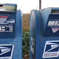Louis DeJoy issues a fuzzy, fact-light statement temporarily suspending changes at the USPS