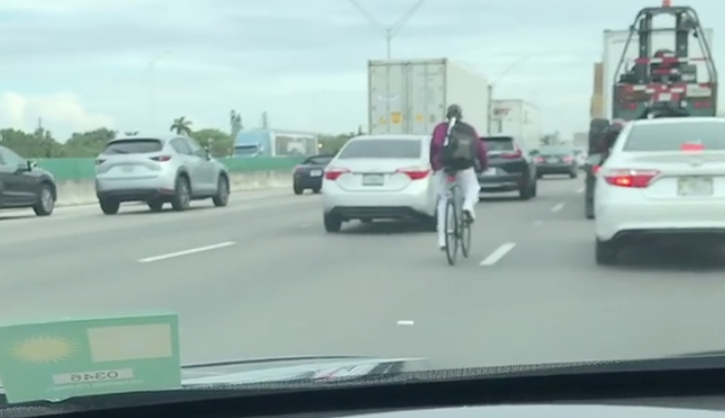 Here's a guy riding his bike on I-95 in Florida