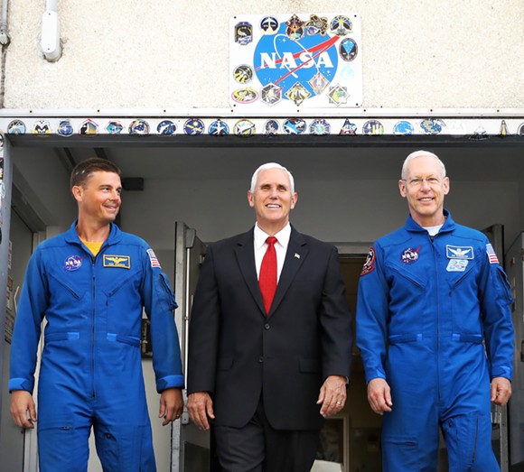 Mike Pence leaves a tour of NASA's Operations and Checkout Building in Cape Canaveral with NASA astronauts Reid Wiseman (left) and Pat Forrester on July 6 2017. - Photo by Joey Roulette