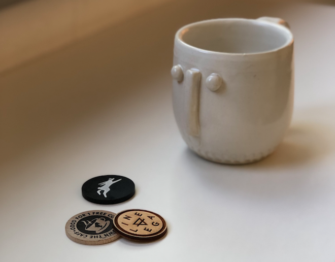 Coffee tokens from Lineage, Easy Luck and Ace Cafe, with a cup by Koozeh Pottery - photo by Jessica Bryce Young