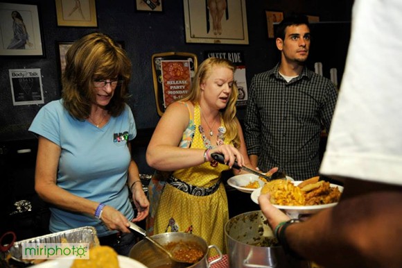 Pawli (center) serving food at the 2013 Benefit for Mustard Seed of Central Florida - Miriphoto