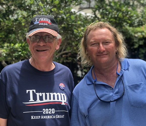 David Fraleigh, 59, and Gary Wayne Beck, 48, pose on Division Avenue while in line the day before President's Trump 2020 re-election announcement. - photo by Christian Casale