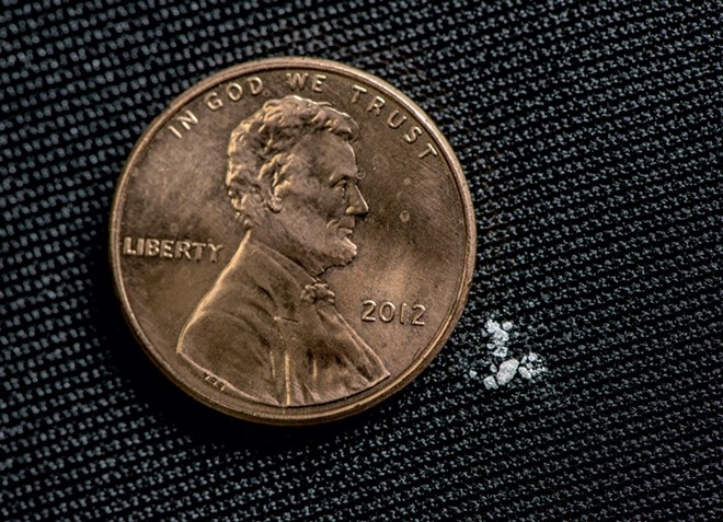 As little as two milligrams of faux fentanyl (pictured here next to a penny) can be a lethal dose - PHOTO COURTESY BEN WESTHOFF