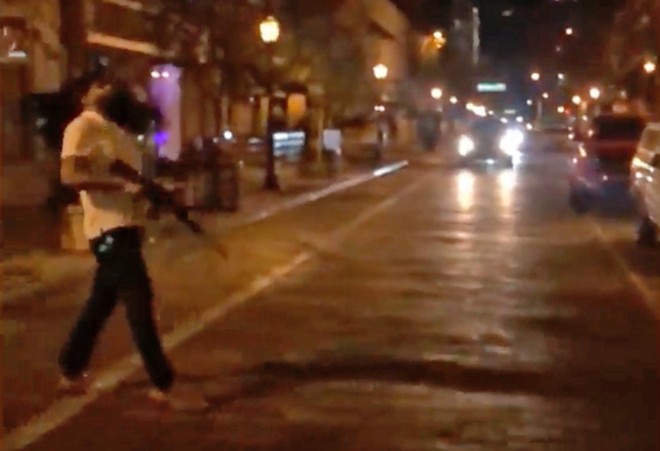 Video shows a man firing an AR-style rifle on the street in downtown Orlando