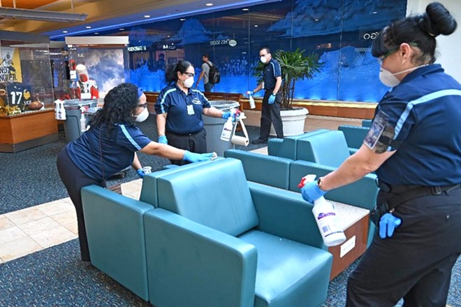 Workers cleaning at Orlando International Airport - PHOTO VIA ORLANDO INTERNATIONAL AIRPORT