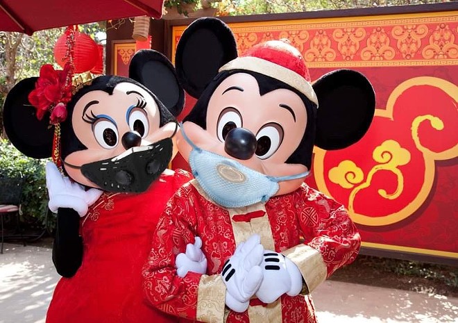 An altered image of Disneyland's Lunar New Year Mickey and Minnie going viral on social media. - Image via Zane/@fugginspam/Twitter