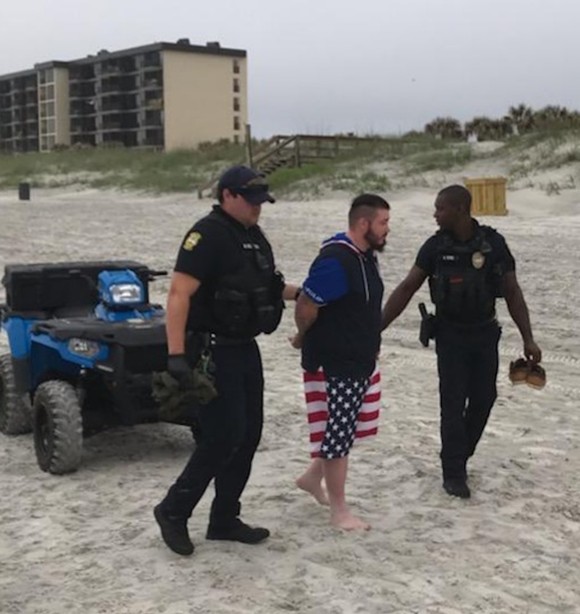 Two Jacksonville Beach Police officers arrest Mario Matthew Gatti on Saturday - PHOTO VIA JAXBEACHPD/TWITTER
