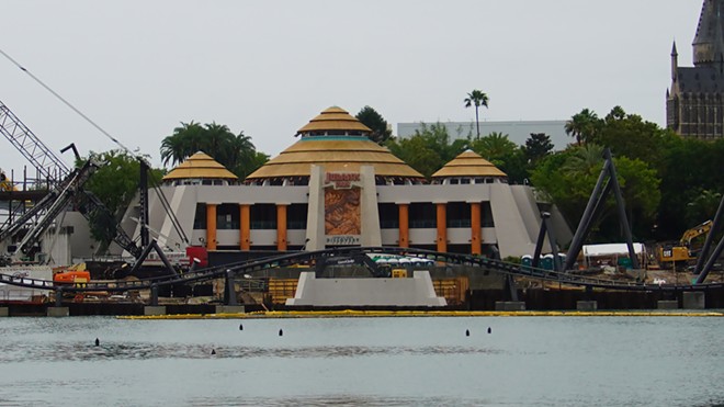 The Discovery Center with the new coaster being installed in front of it. As seen from the Port of Entry. - Image via Bioreconstruct | Twitter