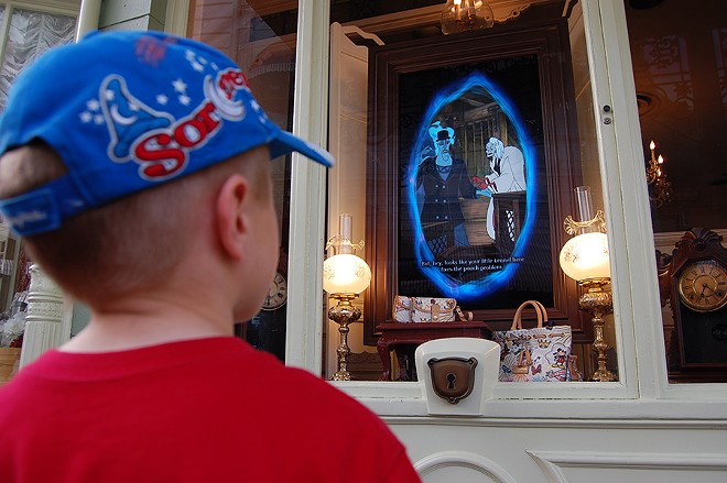 Game portals, like this one on Main Street, were designed to blend in with their land. - Image via Disney