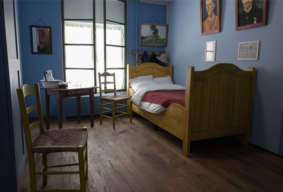 A recreation of the Arles Bedroom from the Van Gogh painting in the Hotel Riche. At the close of WWII, the original  bed from Arles was donated to Boxmeer, by the Van Gogh family, to be used by local residents displaced by the war. Boxmeer, The Netherlands. - Photograph by Patricia Lanza
