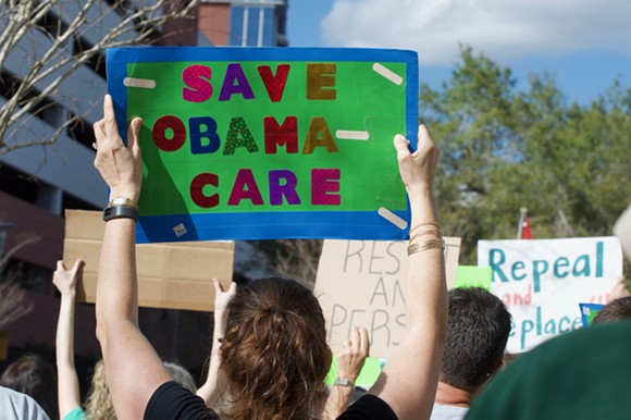 Hundreds rally in Orlando to save Obamacare
