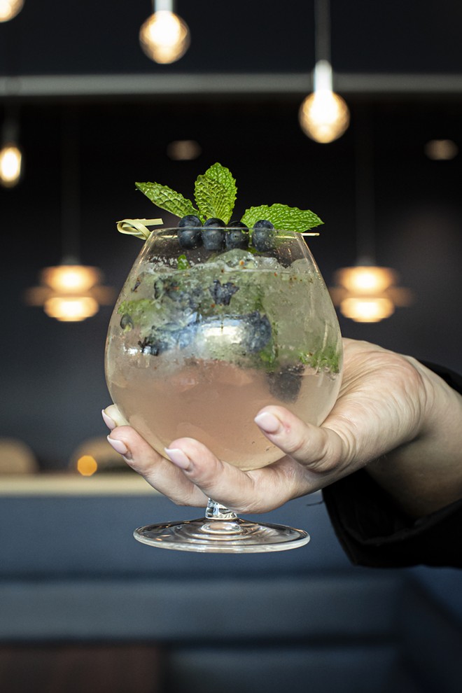 Zodiac mocktail with muddled blueberries and mint - photo by Rob Bartlett