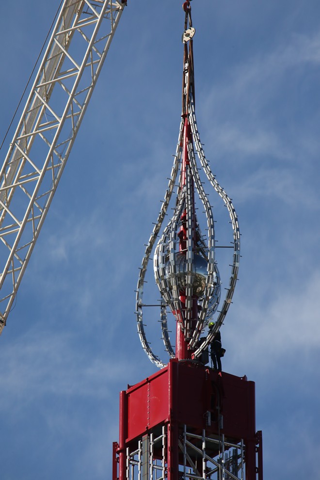 A close up of the wind dancer candle stick ornament that sits atop of the Orlando Free Fall drop tower - Image via Slingshot Group of Companies | Orlando Free Fall