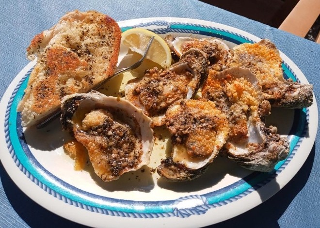 Charbroiled oysters: High Tide Harry's - photo by Louis Rosen