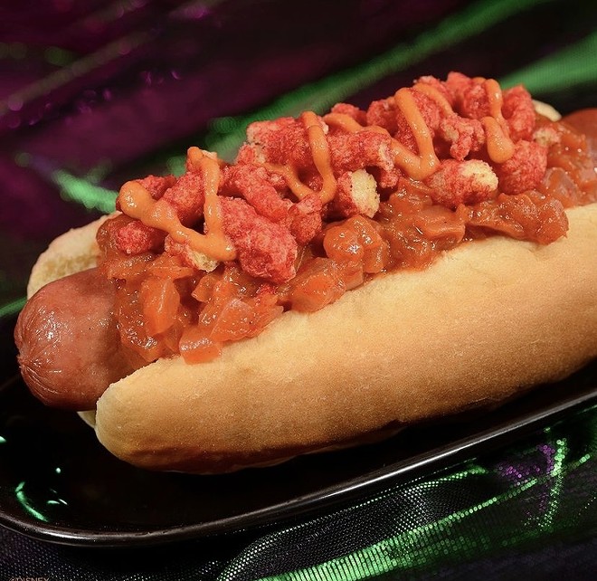 Hot dog topped with spicy cheese flavored snacks. - Via @DisneyParks on Instagram