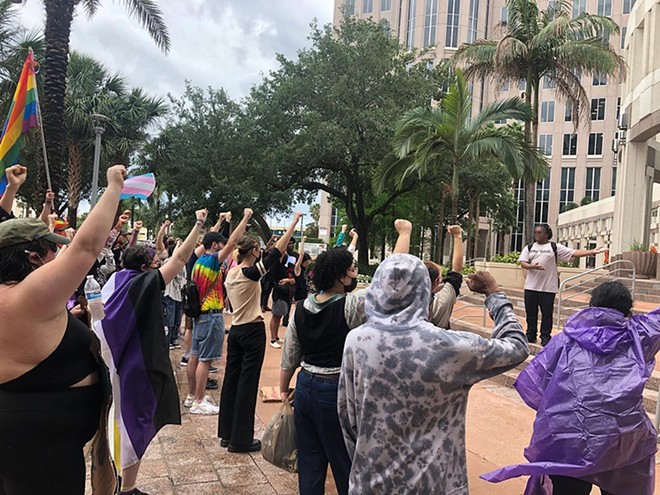 LGBTQ+ activists and allies rally in support of transgender rights outside Orlando City Hall on April 24, 2023. - photo by McKenna Schueler