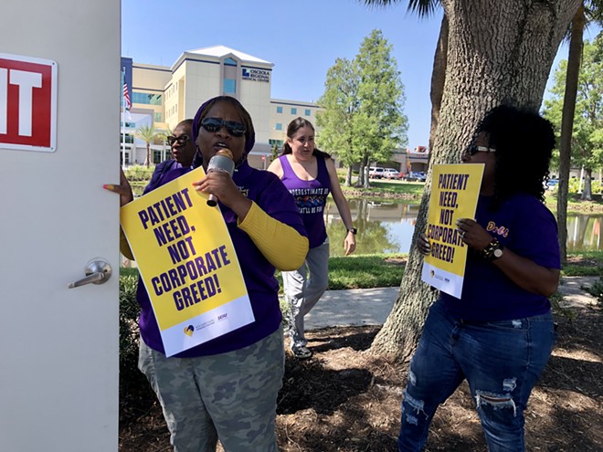 Employees of HCA Florida Osceola Hospital rally outside the hospital over understaffing, which they say is creating unsafe conditions for patients (May 10, 2023) - photo by McKenna Schueler